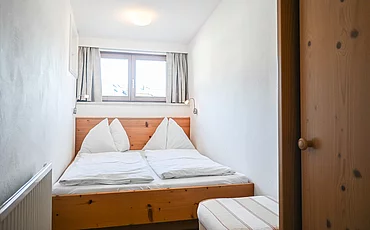 Das Schlafzimmer des Landhaus Family des Pechtlguts in Lofer