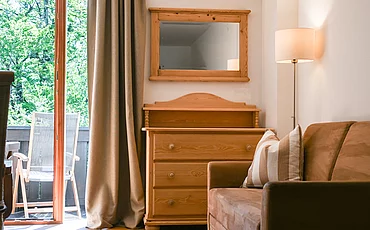 A wooden chest of drawers in the main house studio at Pechtlgut in Lofer