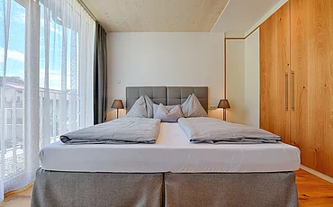 Gemütliches Boxspringbett im Family Haupthaus im Pechtlgut in Lofer