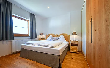 Gemütliches Boxspringbett im Family Haupthaus im Pechtlgut in Lofer