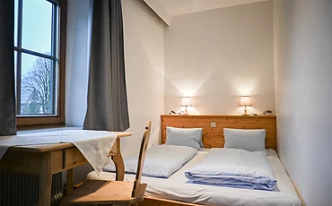 Ein Schlafzimmer im Landhaus Family des Pechtlguts in Lofer